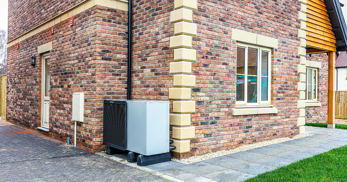 Heat Pump Week 3 CBH A daikin heat pump next to a new build house